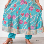 Teal floral dress with pink flowers on a white background