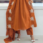 Orange traditional outfit with white floral embroidery on a white background