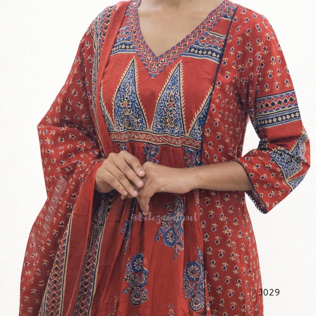 Red dress with blue and white patterns on a white background