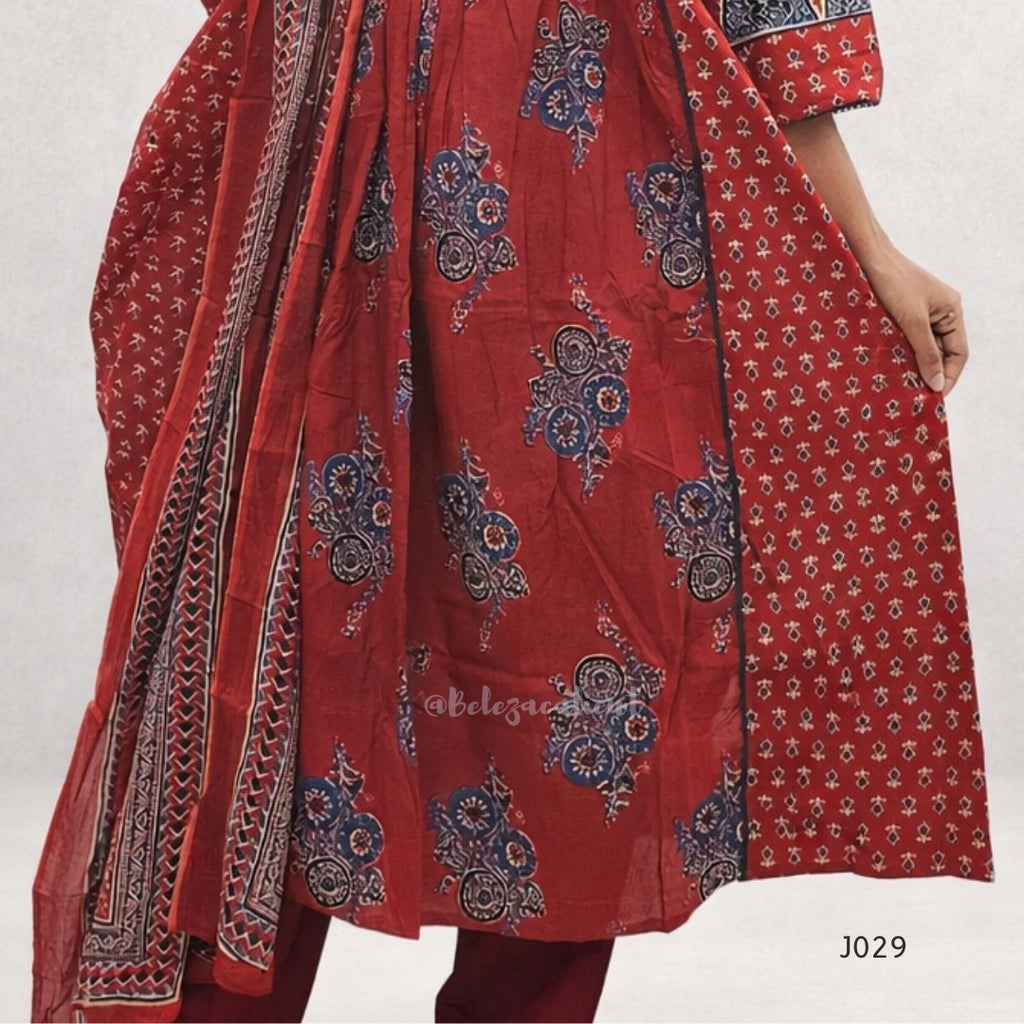 Red traditional outfit with intricate patterns on a white background