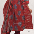 Red traditional outfit with intricate patterns on a white background