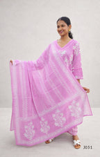 Woman wearing a pink traditional outfit with white patterns on a plain background