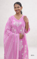 Woman wearing a pink traditional outfit with white floral patterns on a white background