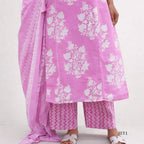 Pink traditional outfit with white floral patterns on a white background