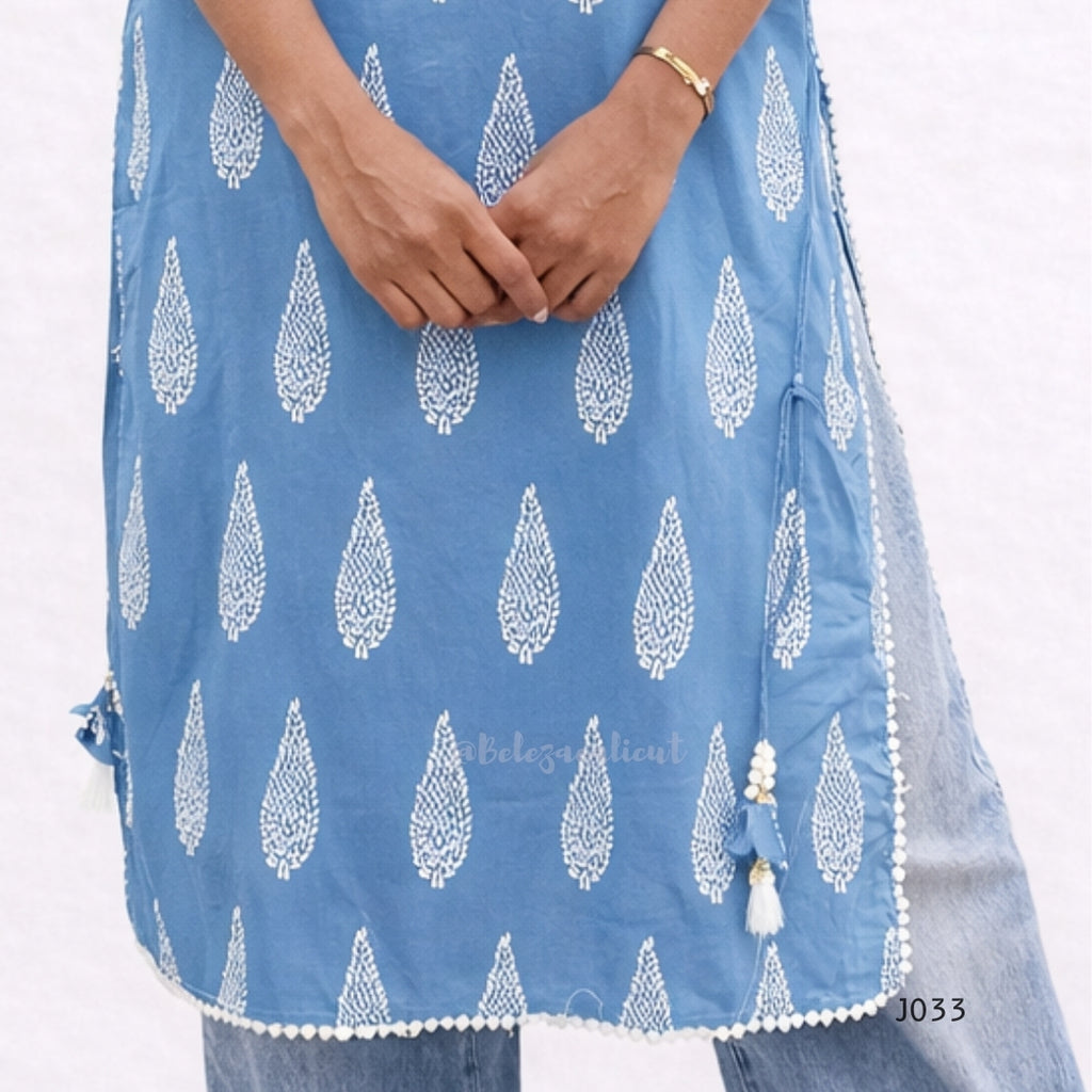 Blue dress with white leaf pattern on a white background