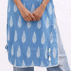 Blue dress with white leaf pattern on a white background