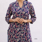 Navy blue floral patterned kurta worn by a person on a white background