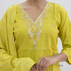 Yellow embroidered traditional outfit with a plain background