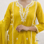 Yellow kurta with white embroidery on a plain background