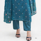 Teal embroidered outfit with matching pants on a white background