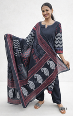 Woman holding a large black and red patterned scarf on a white background
