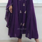 Purple dress with floral embroidery on a white background