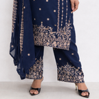 Navy blue traditional outfit with gold embroidery on a white background