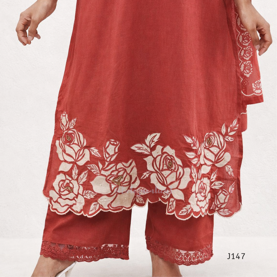 Red garment with white floral embroidery on a white background