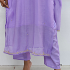 Purple embroidered garment on a plain background