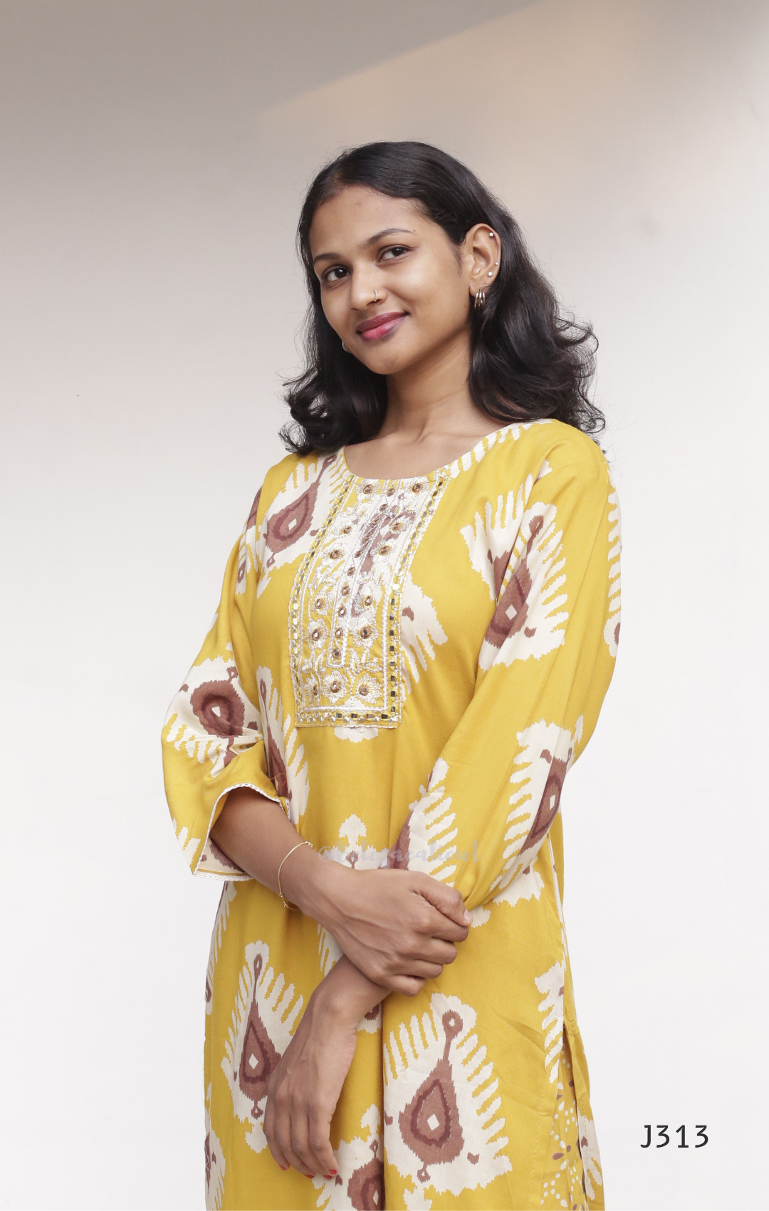 Mustard yellow soft cotton kurti set with cream brown ikat-style print and matching printed bottom, available at Beleza Calicut Kerala.