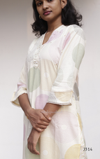 Cream soft cotton kurti set with pastel circle print, straight-cut cotton churidar set for women, available at Beleza Calicut Kerala