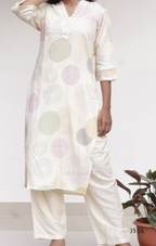 Cream soft cotton kurti set with pastel circle print, straight-cut cotton churidar set for women, available at Beleza Calicut Kerala