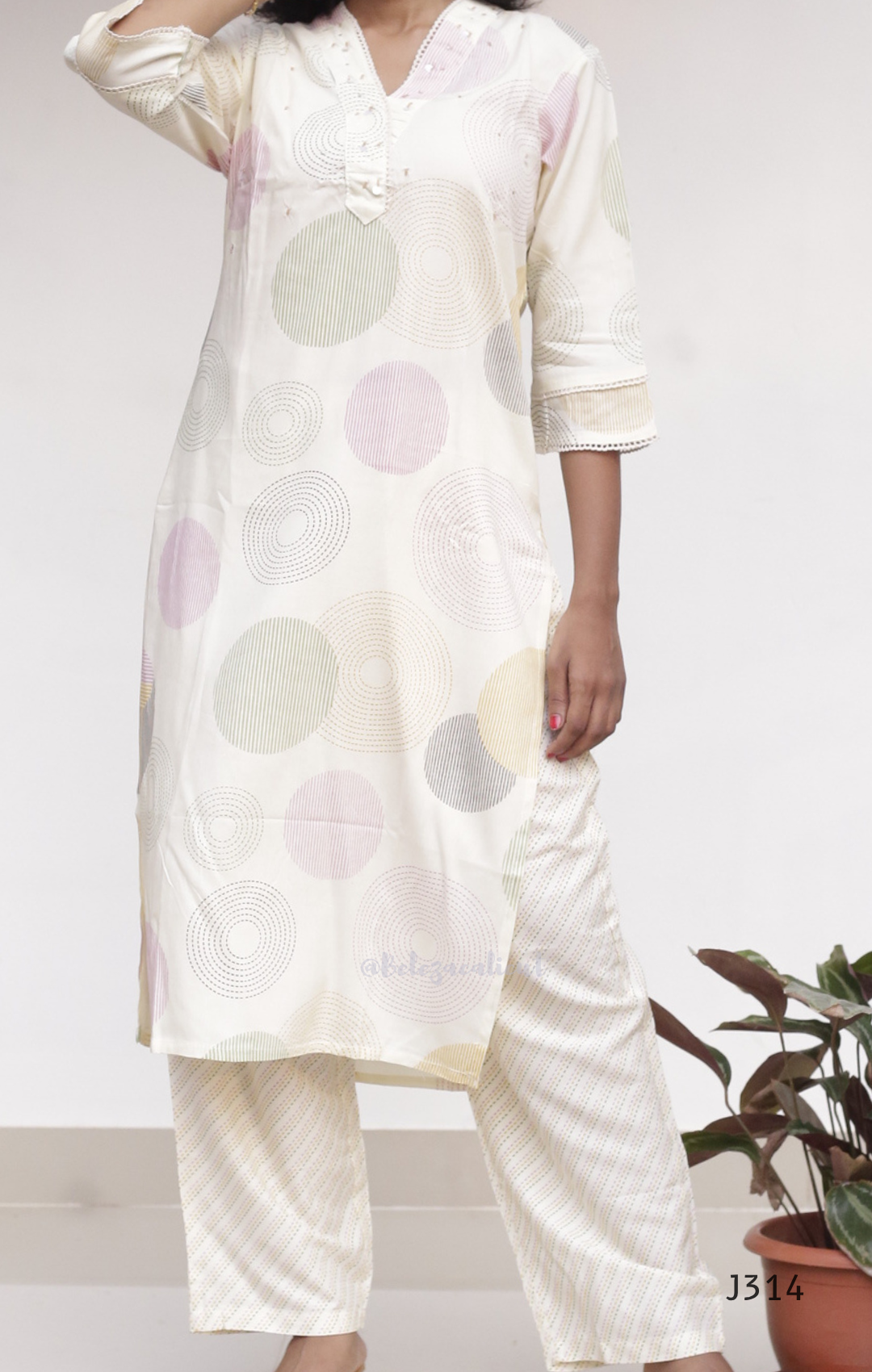 Cream soft cotton kurti set with pastel circle print, straight-cut cotton churidar set for women, available at Beleza Calicut Kerala