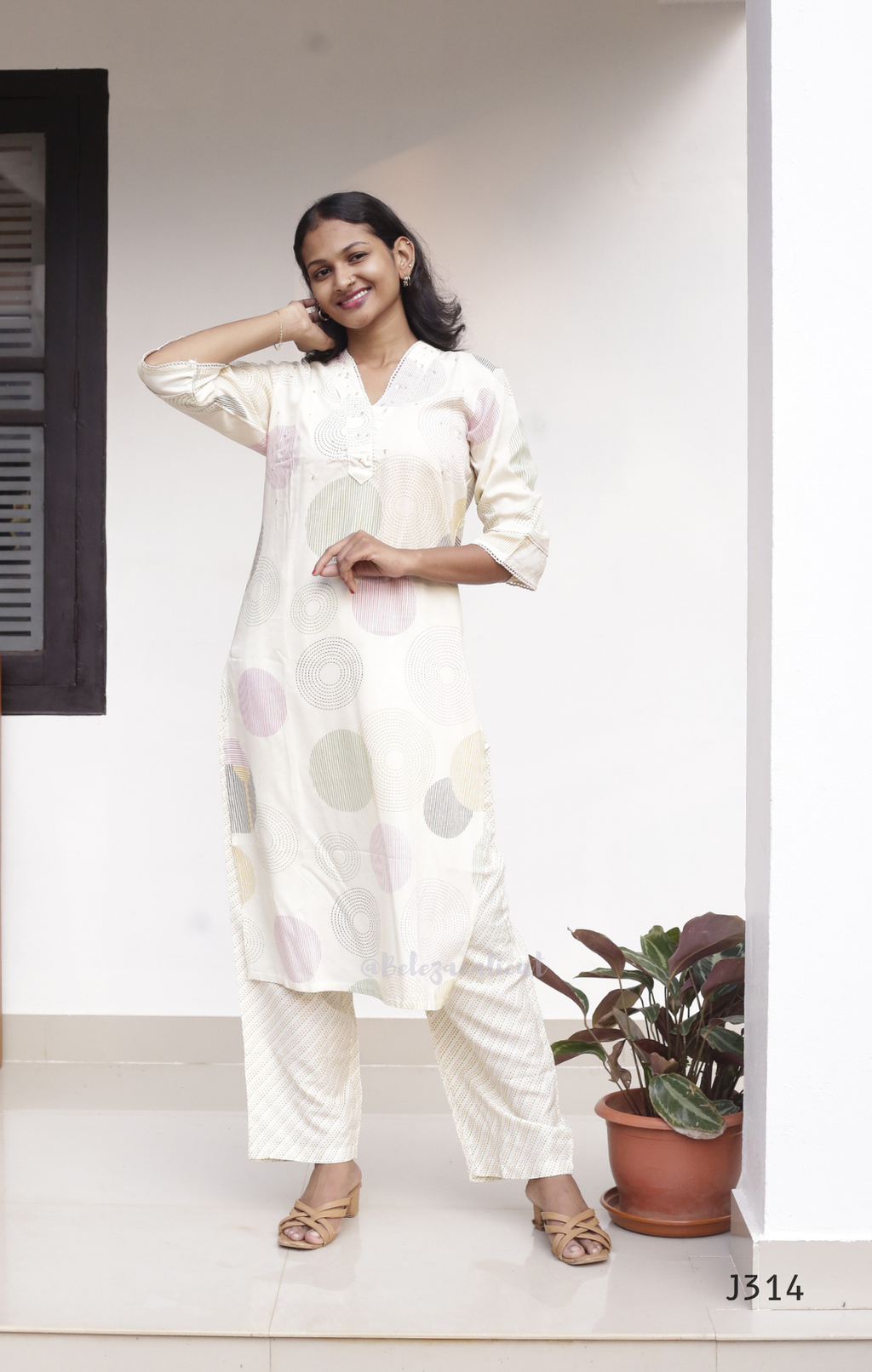 Cream soft cotton kurti set with pastel circle print, straight-cut cotton churidar set for women, available at Beleza Calicut Kerala