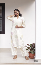 Cream soft cotton kurti set with pastel circle print, straight-cut cotton churidar set for women, available at Beleza Calicut Kerala