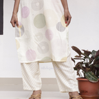 Cream soft cotton kurti set with pastel circle print, straight-cut cotton churidar set for women, available at Beleza Calicut Kerala