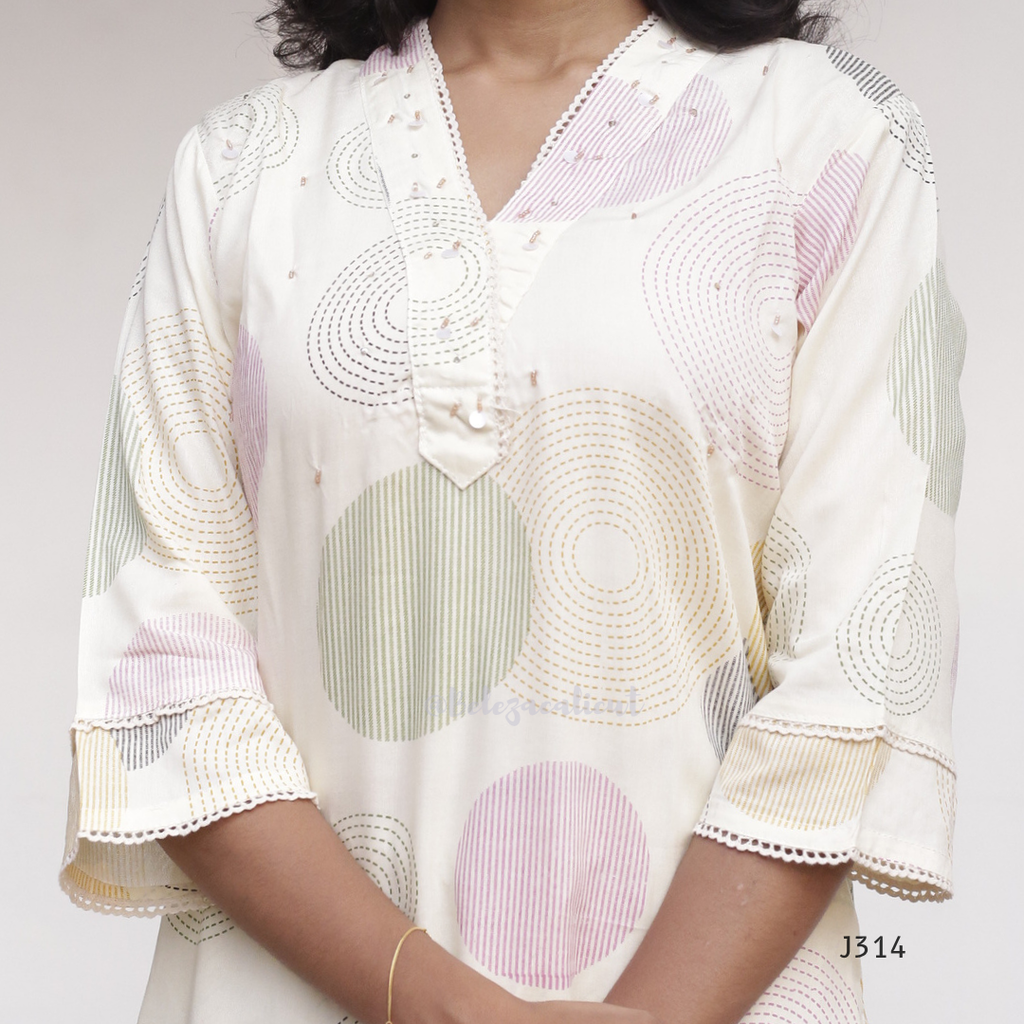 Cream soft cotton kurti set with pastel circle print, straight-cut cotton churidar set for women, available at Beleza Calicut Kerala