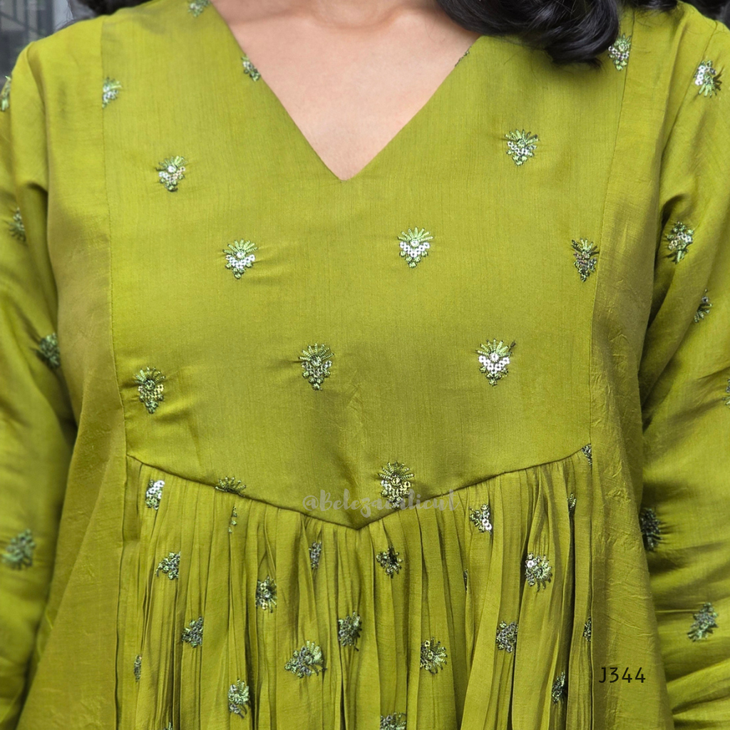 Green dress with floral patterns on a plain background