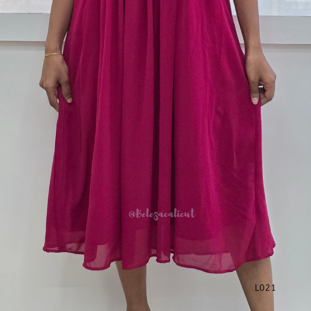 Fuchsia dress worn by a person on a white background