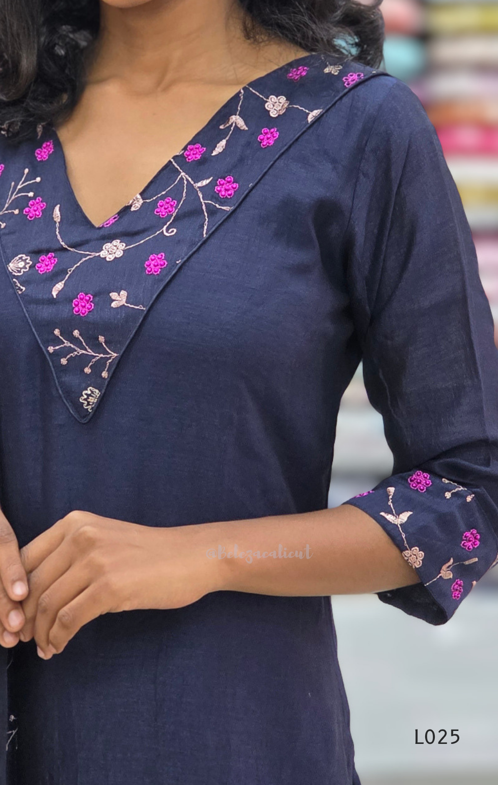 Navy blue kurta with floral embroidery on neckline and sleeves, brand 'L025' visible.
