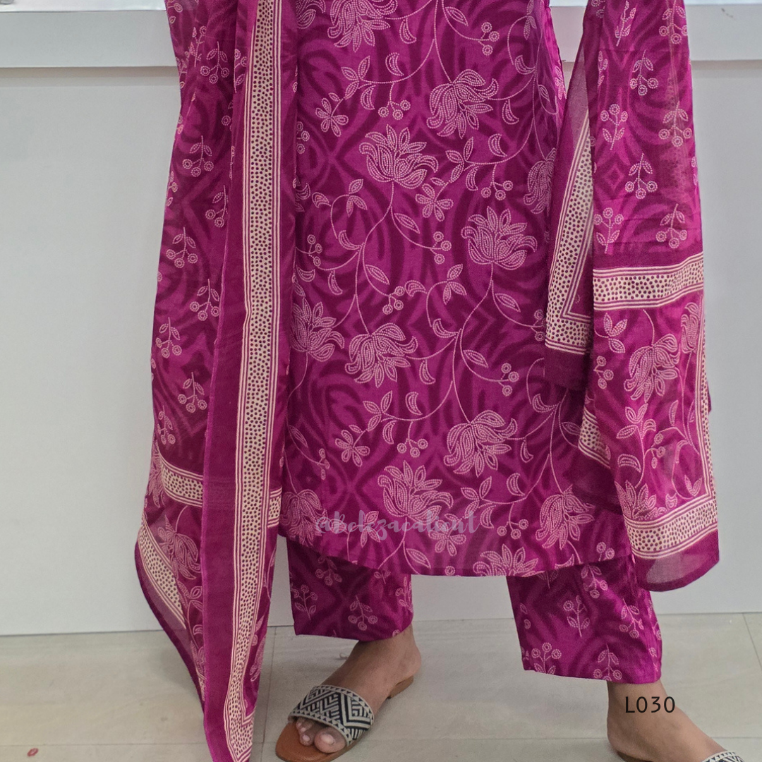 Purple traditional outfit with floral patterns on a white background