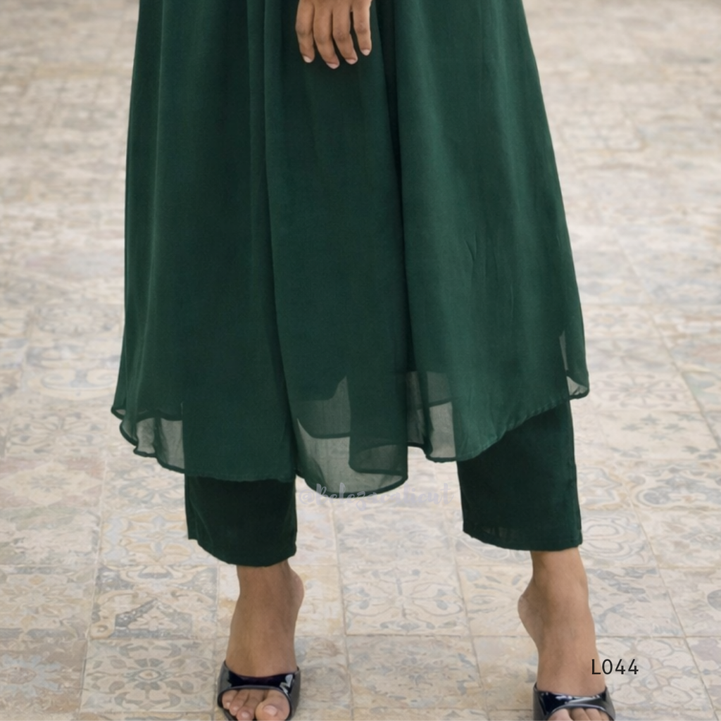 Green dress with a plain background