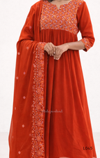 Orange traditional outfit with floral patterns on a white background