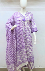 Soft cream and lavender cotton churidar set with floral print, dupatta and mirror-style neckline. Available at Beleza Calicut.