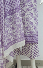 Soft cream and lavender cotton churidar set with floral print, dupatta and mirror-style neckline. Available at Beleza Calicut.