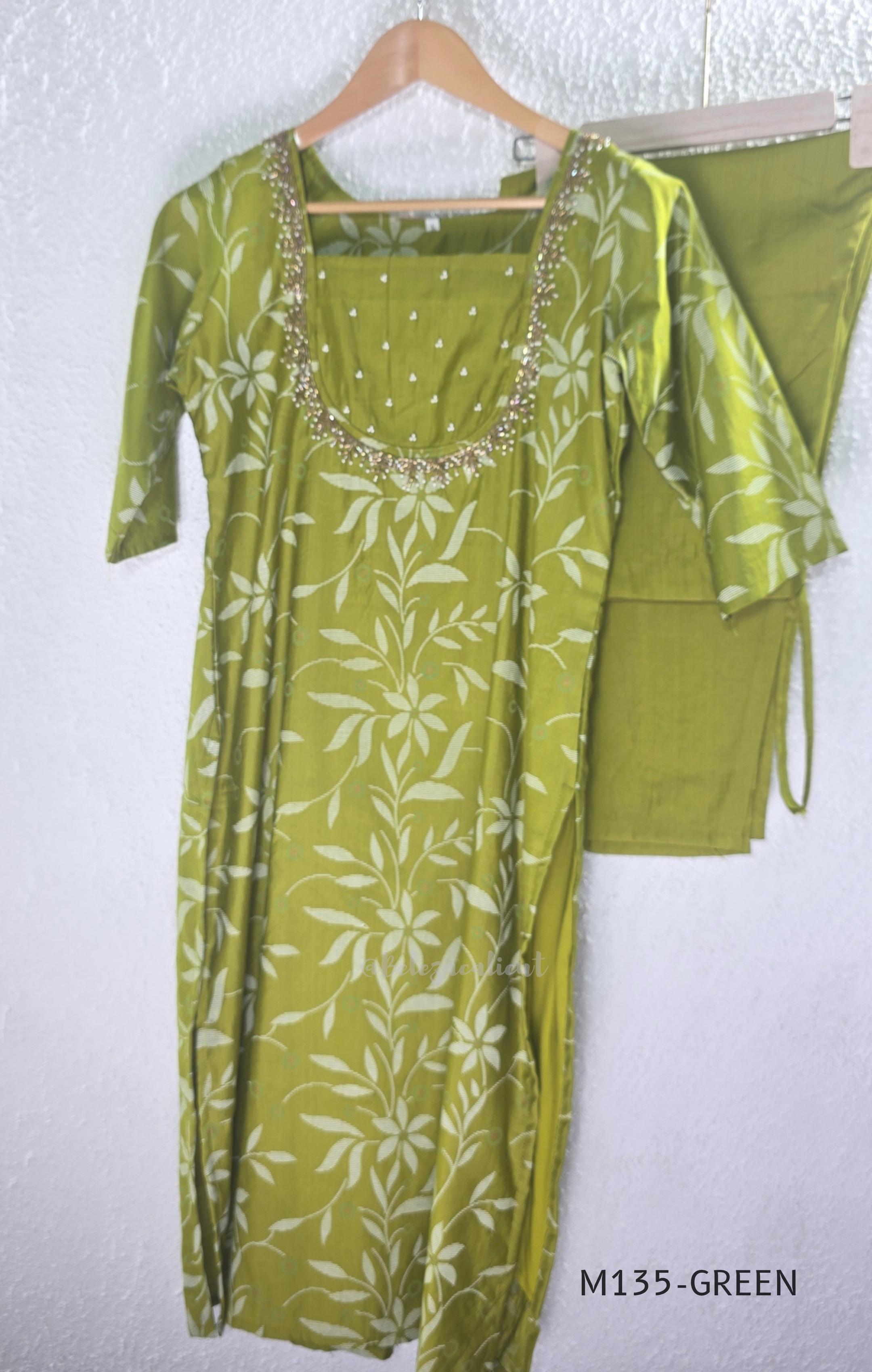 Leaf green silk blend 2-piece set with ivory botanical print, embellished deep neckline, three-quarter sleeves and matching plain bottom.