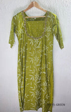 Leaf green silk blend 2-piece set with ivory botanical print, embellished deep neckline, three-quarter sleeves and matching plain bottom.