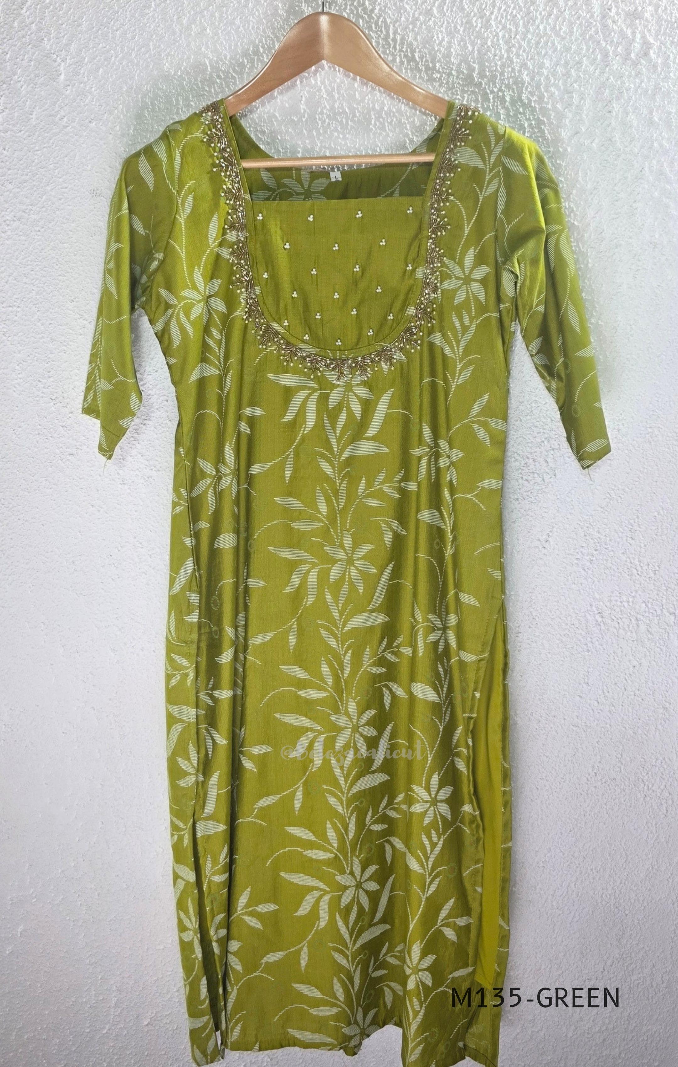 Leaf green silk blend 2-piece set with ivory botanical print, embellished deep neckline, three-quarter sleeves and matching plain bottom.