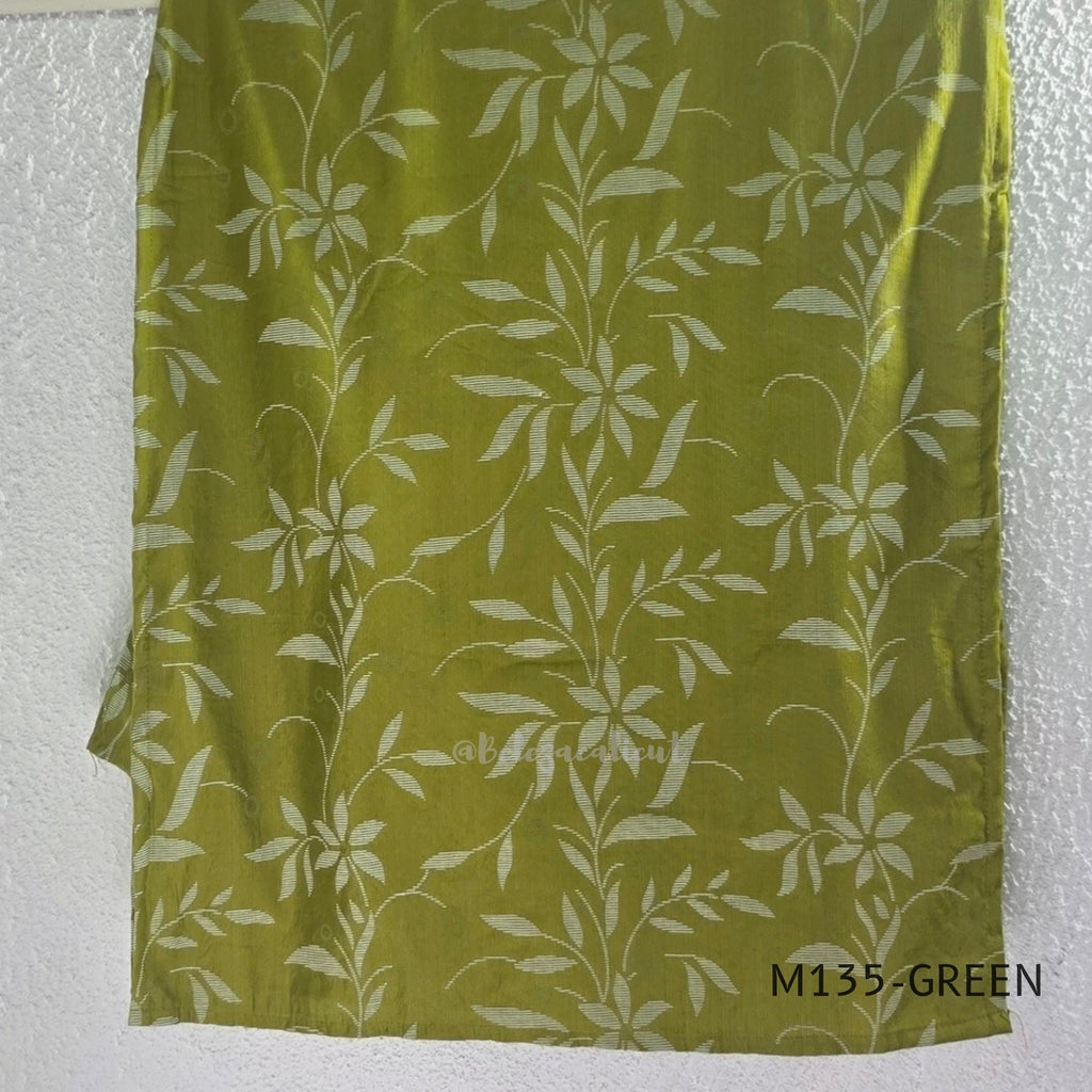Leaf green silk blend 2-piece set with ivory botanical print, embellished deep neckline, three-quarter sleeves and matching plain bottom.