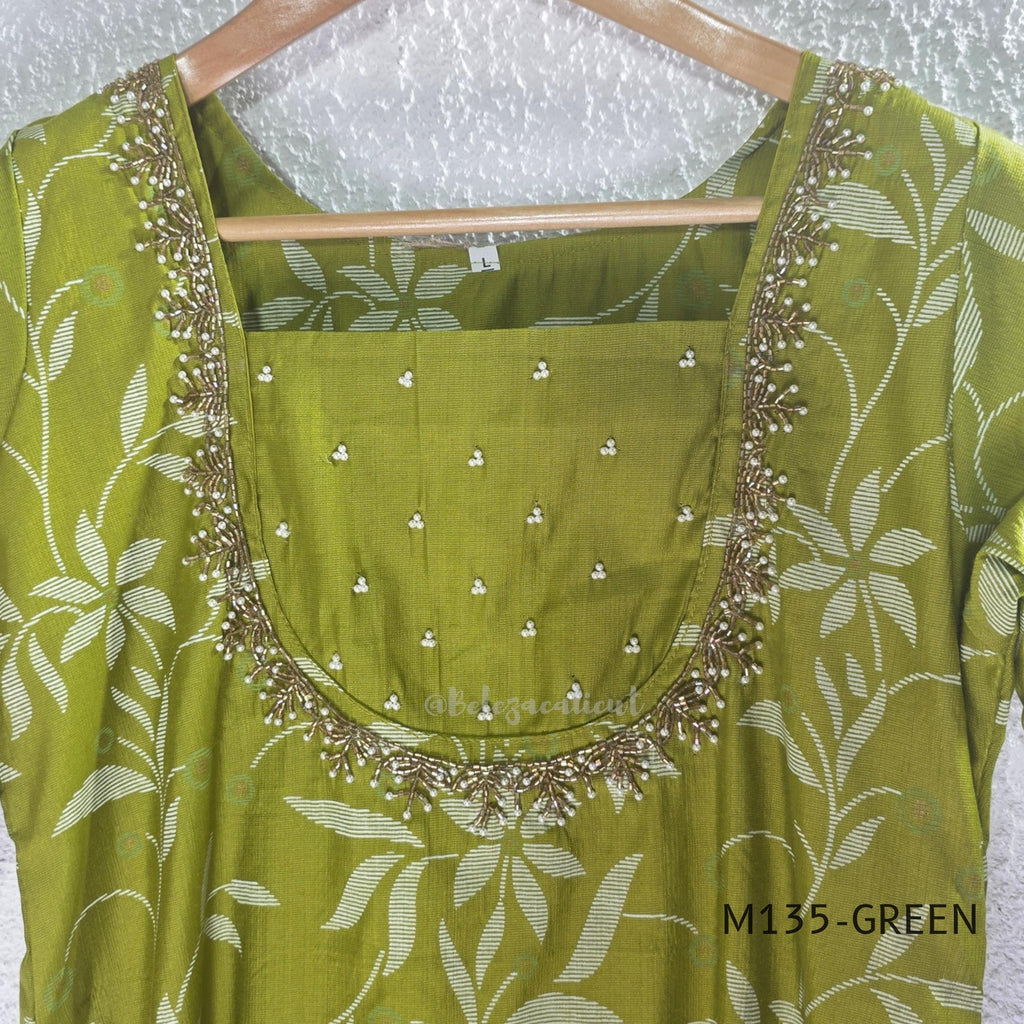 Leaf green silk blend 2-piece set with ivory botanical print, embellished deep neckline, three-quarter sleeves and matching plain bottom.
