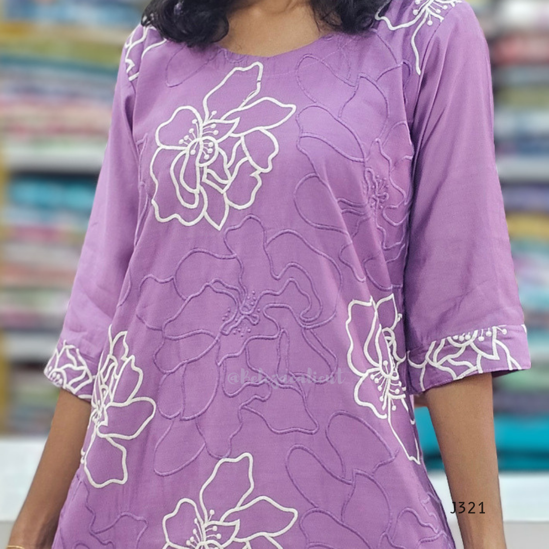 Purple dress with white floral patterns on a blurred background
