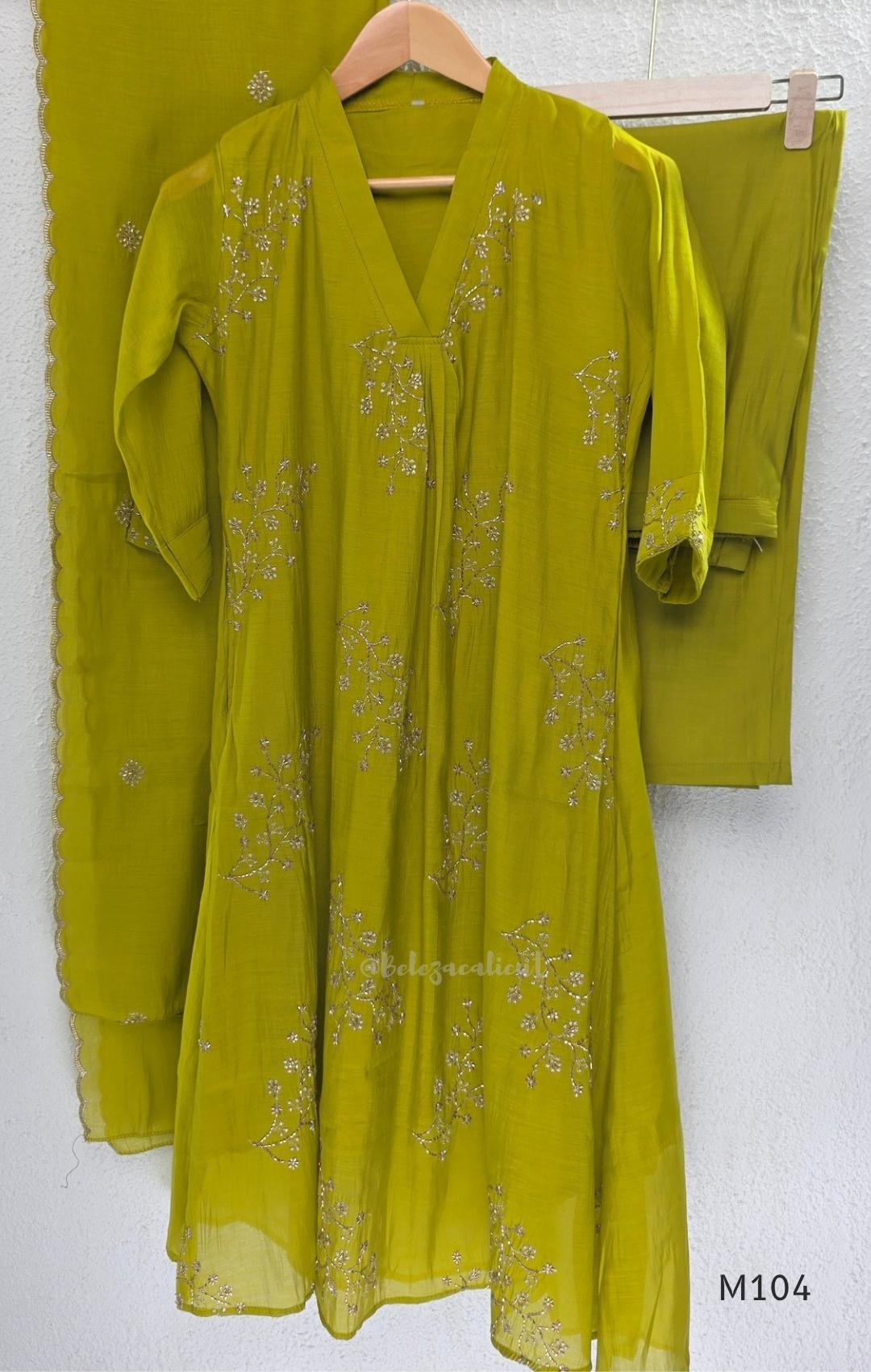 Lime green Mul Chanderi A-line churidar set with silver-toned floral vine work and matching dupatta.