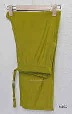 Lime green Mul Chanderi A-line churidar set with silver-toned floral vine work and matching dupatta.