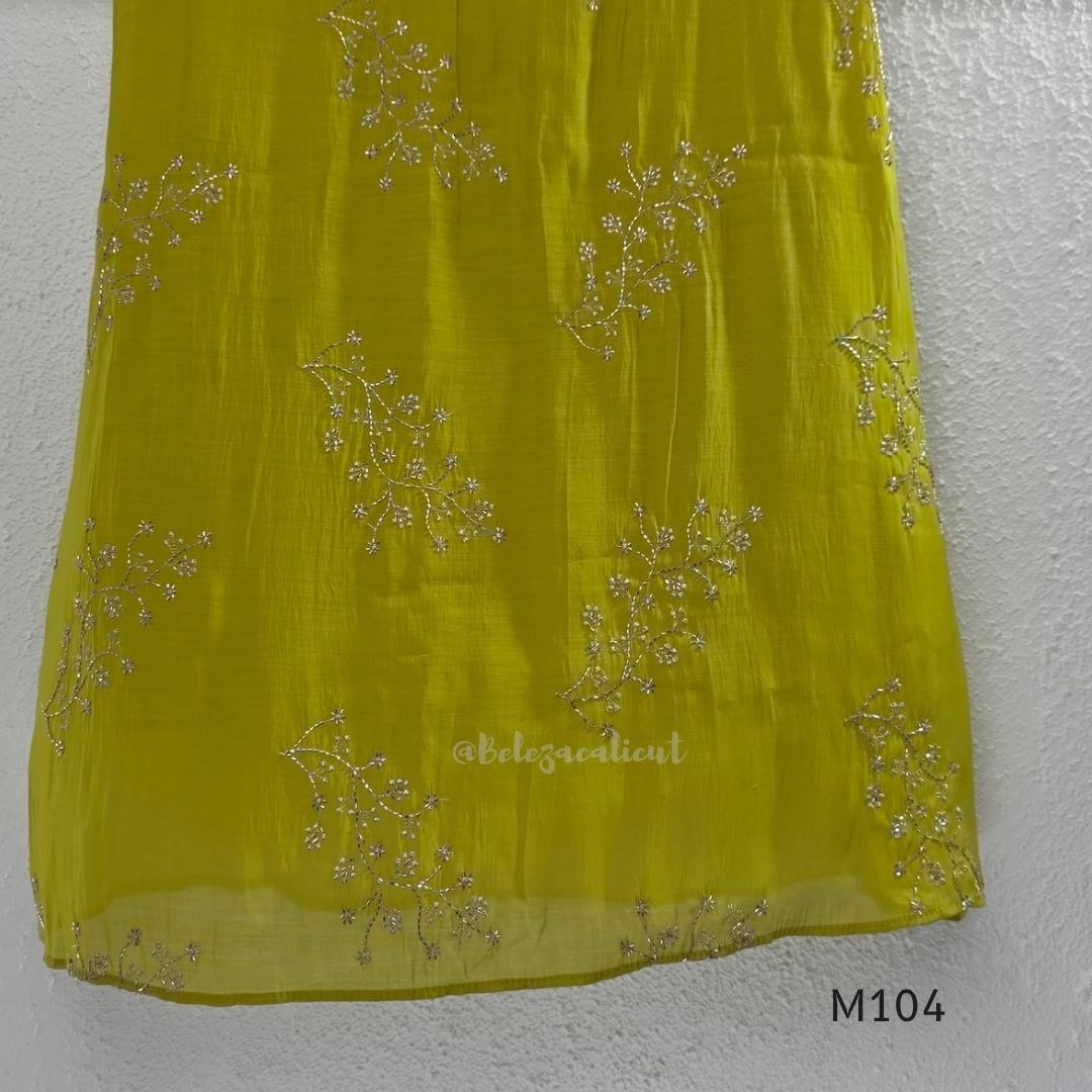 Lime green Mul Chanderi A-line churidar set with silver-toned floral vine work and matching dupatta.