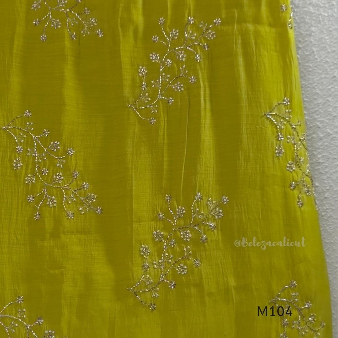 Lime green Mul Chanderi A-line churidar set with silver-toned floral vine work and matching dupatta.