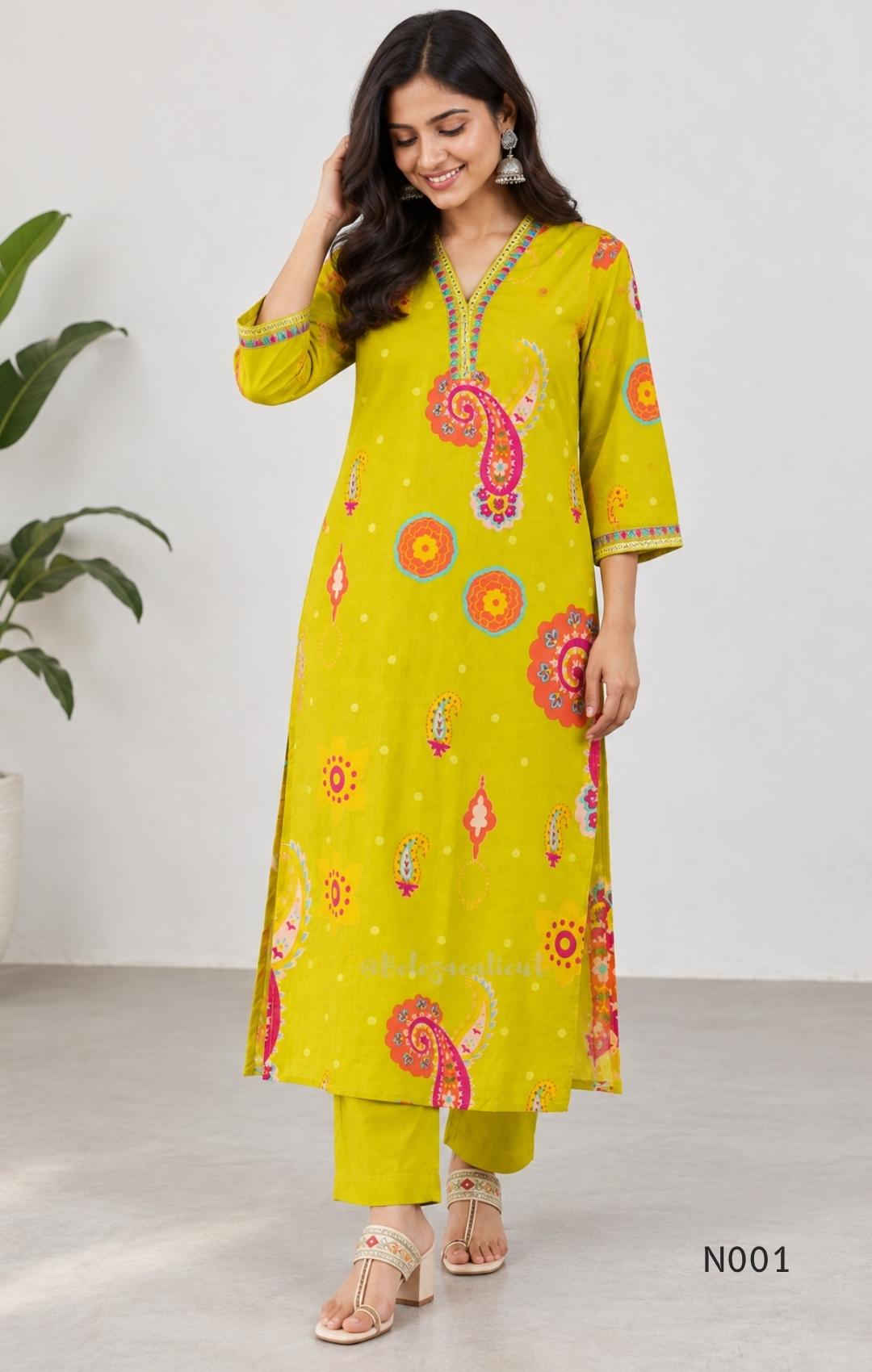 Lime yellow cotton top and bottom set with multicolour paisley and floral print and decorative V-neck trim.