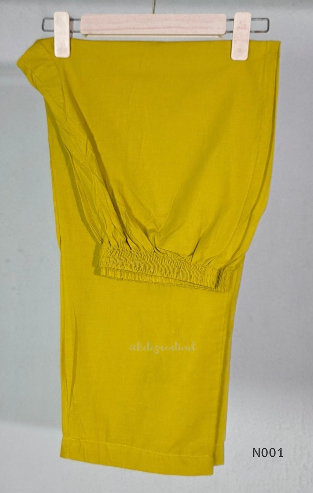 Lime yellow cotton top and bottom set with multicolour paisley and floral print and decorative V-neck trim.