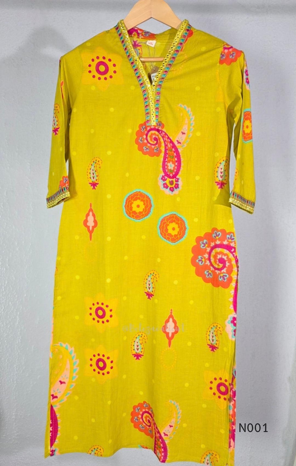 Lime yellow cotton top and bottom set with multicolour paisley and floral print and decorative V-neck trim.