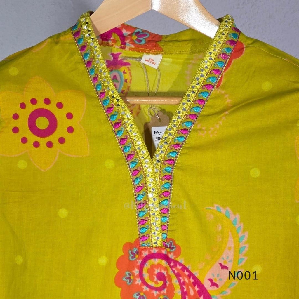 Lime yellow cotton top and bottom set with multicolour paisley and floral print and decorative V-neck trim.