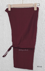 Deep maroon Vertigan silk co-ord set with pleated A-line top, gold circular side motifs and matching straight pants.